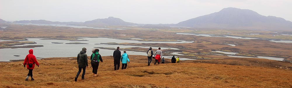 students walking across Western Isles moorland
