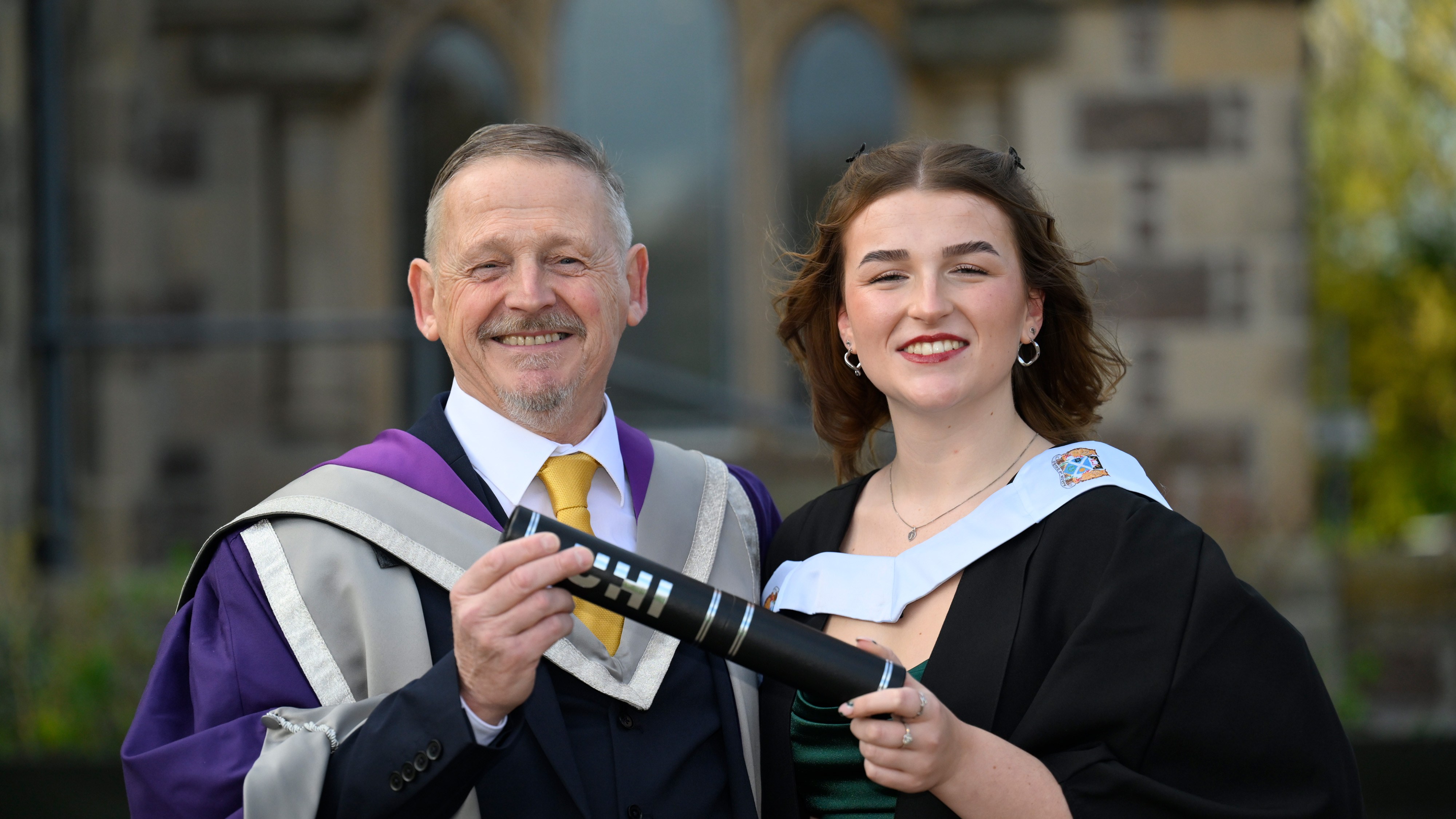 Patrick and Dorothy Mullery holding a scroll