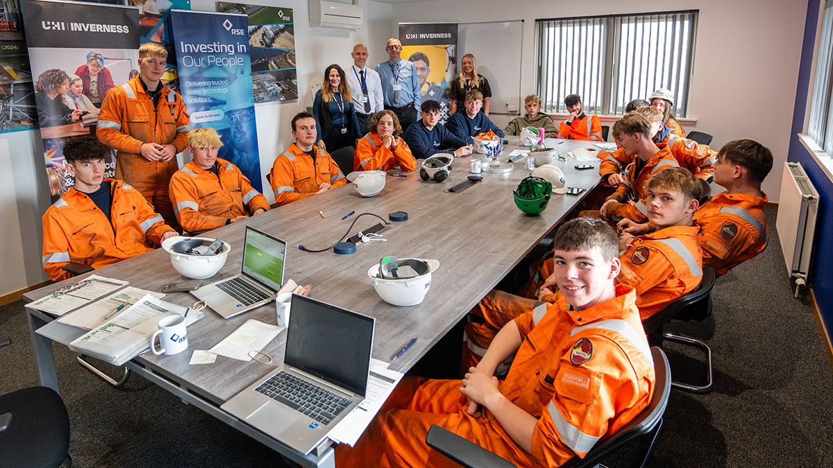 A group of apprentices and staff A group of apprentices and staff