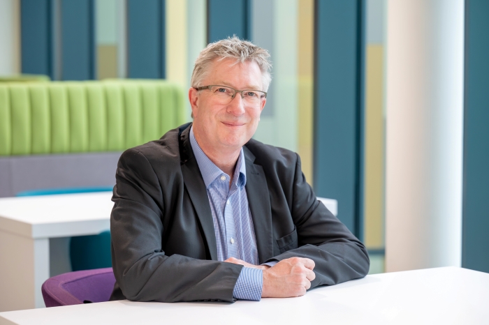Mike Baxter sitting at a table