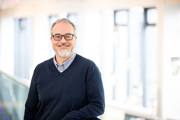 Richard Emborg standing smiling towards the camera