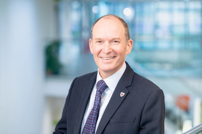 Roger Sendall, Deputy University Secretary, in formal business attire picture against a blue backdrop at An Lochran on Inverness Campus Roger Sendall, Deputy University Secretary, in formal business attire picture against a blue backdrop at An Lochran on Inverness Campus