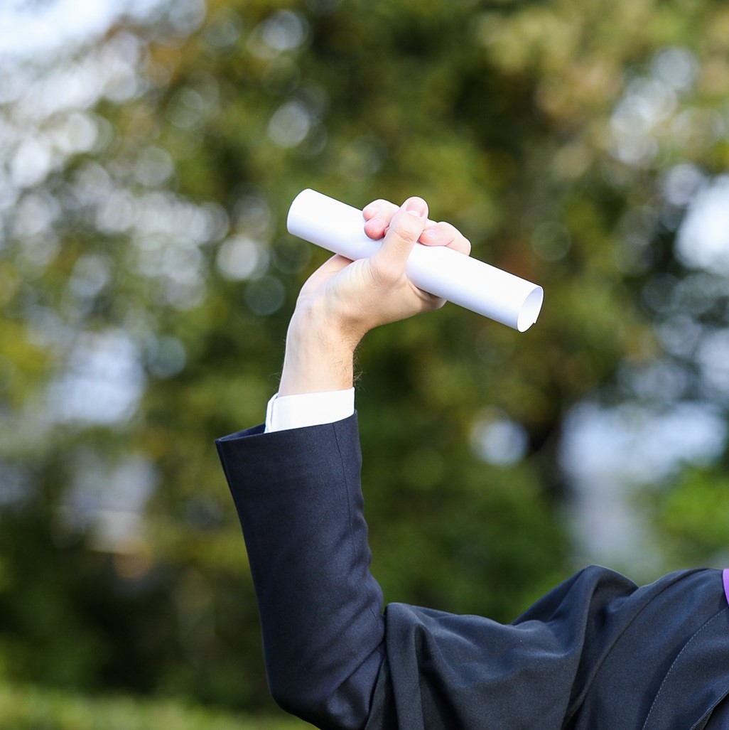 Graduate holding certificate