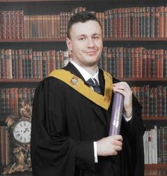 Male student in graduation robe