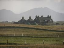Nunton House, Benbecula, against the hills of South Uist