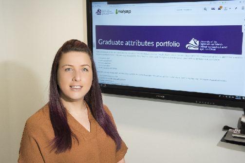 Person standing in front of Graduate Attributes Portfolio