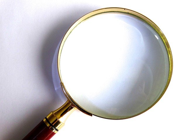 Magnifying glass with the word evaluation in it