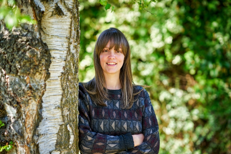 Kayleigh Hunter stood next to a tree
