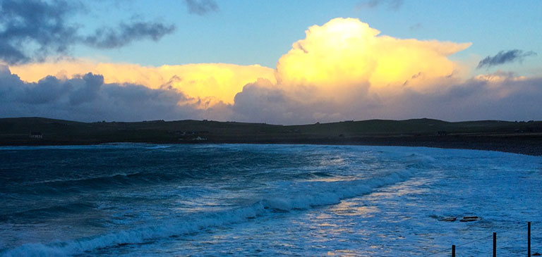 Waves crashing onto beach