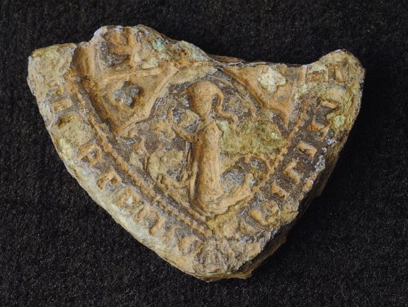 Fig. 5 Broken matrix of a medieval seal found by a metal detectorist in Deerness, East Mainland, Orkney (Courtesy Orkney Islands Council Fig. 5 Broken matrix of a medieval seal found by a metal detectorist in Deerness, East Mainland, Orkney (Courtesy Orkney Islands Council