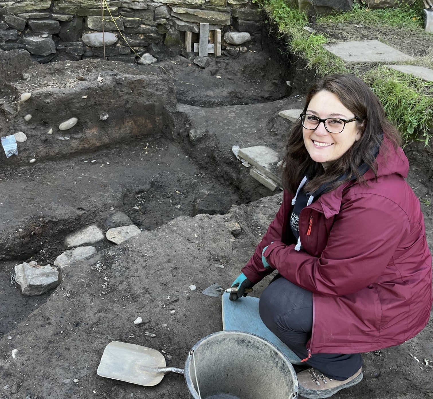 A photograph of Shanna Bryman at an archaeology dig