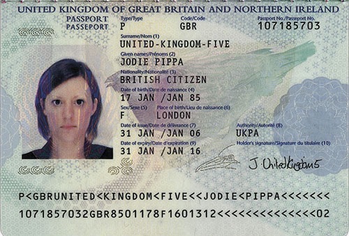 Example of a UK passport that is a specimen which is clear and showing the whole page along with the photo of the person